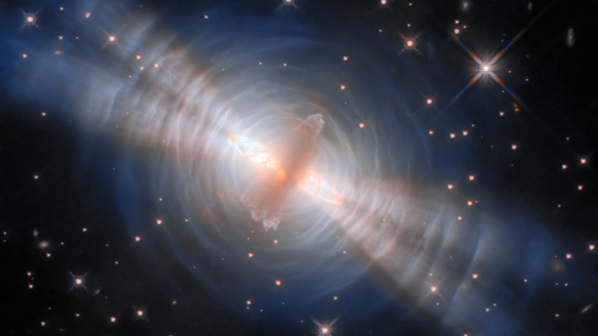 Twin beams blast from a hidden star in stunning Hubble Space Telescope image